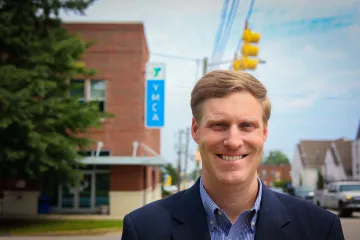 AgFirst's Hampton Jordan in front of YMCA