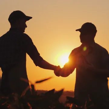 Farmers shake hands